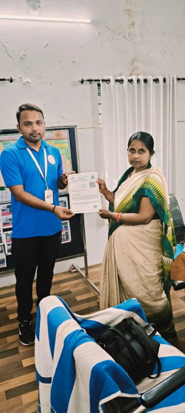 A student receiving recognition during an indoor association presentation.