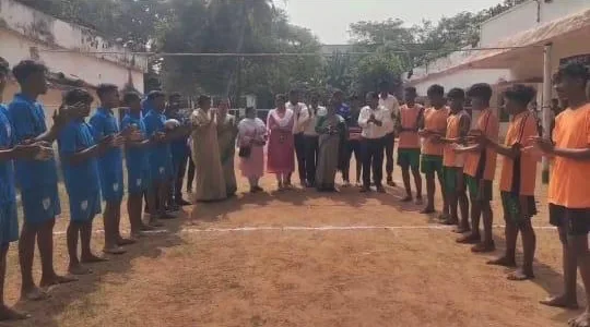 Students standing in a wide formation during a field activity.